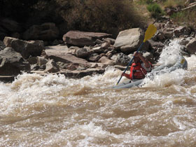 Whitewater inflatable kayaking in Cataract Canyon through Canyonlands National Park